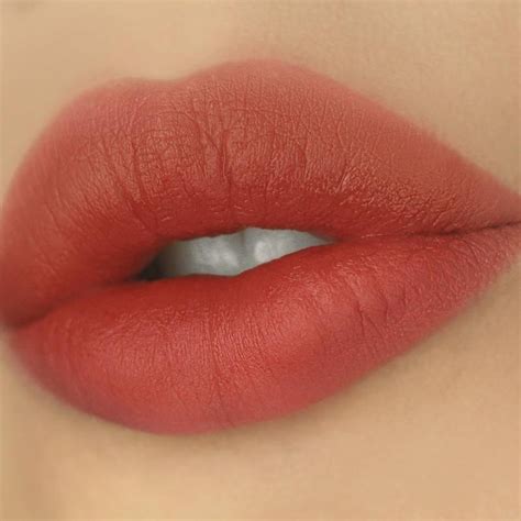 deep brick red lipstick.